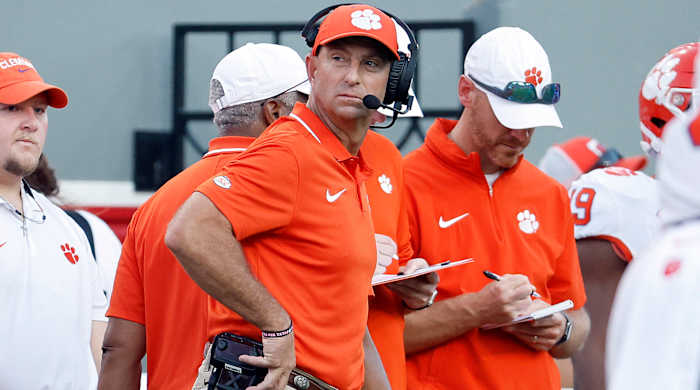 Clemson head coach Dabo Swinney watches a replay from the sideline during the second half against NC State.